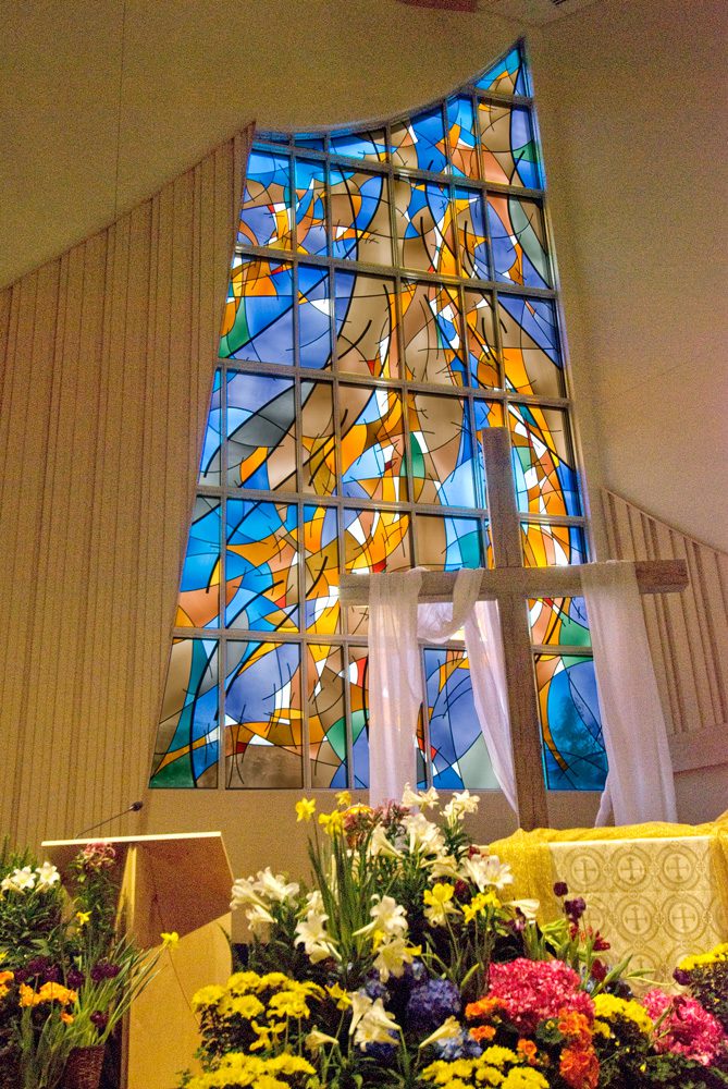 photo of stained glass behind altar