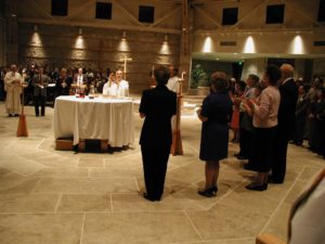 Eucharistic Ministers gathered around the Altar
