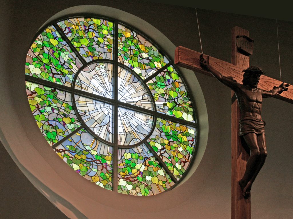 Contemporary rose window depicts the Christian Trinity